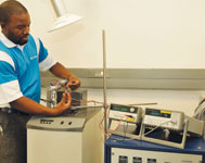 Comparison procedure in a calibration bath being performed by Endress+Hauser quality and metrology technician Mboni Tshifhango